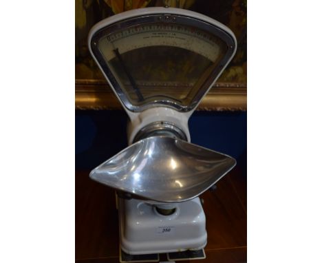 A set of vintage Avery enamel counter top shop scales