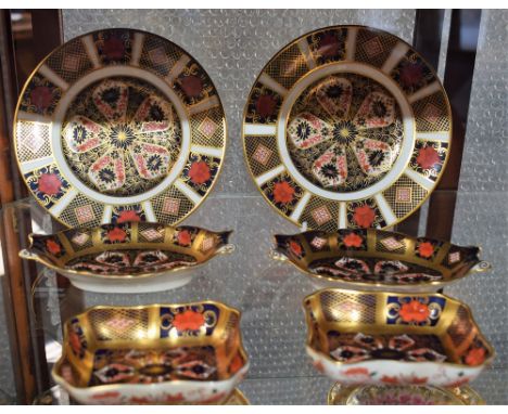 A pair of Royal Crown Derby 1128 pattern solid gold band oval footed pin dishes; another pair, similar, rectangular; a pair o