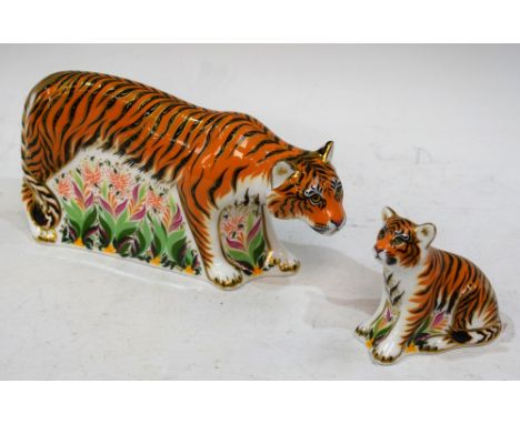 A Royal Crown Derby paperweight, Sumatran Tigress, gold stopper, boxed; another, Sumatran Tiger Cub, gold stopper, boxed (2) 