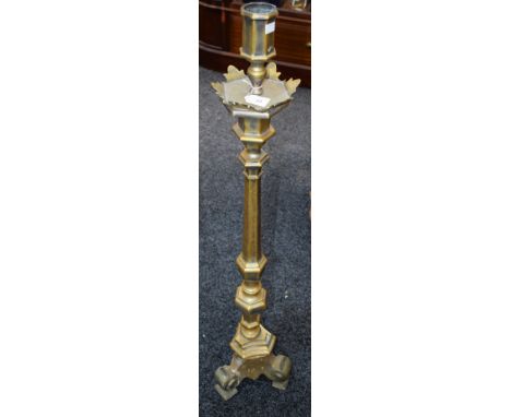 An Ecclesiastical type floor standing candlestick, 122cm high