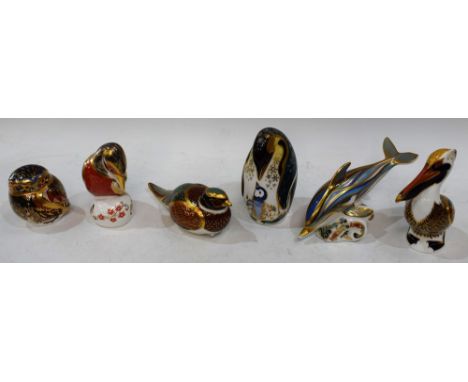 A Royal Crown Derby paperweight, Penguin and Chick, gold stopper; others, Striped Dolphin, Brown Pelican, Kingfisher, Woodlan