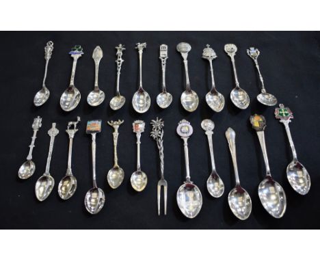A silver and enamel souvenir teaspoon, Innsbruck, others similar; a pickle fork; quantity
