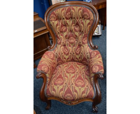 A Victorian mahogany button back armchair, floral upholstery in the manner of William Morris, c.1880