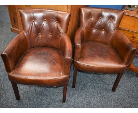 A pair of contemporary leather button back low arm club/tub chairs (2)