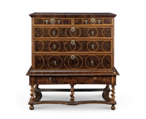 A late 17th century walnut, fruitwood and oyster veneered chest on standWith two short drawers above three long graduating dr