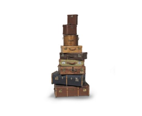 A collection of antique and vintage luggage20th centuryTo include two large travel trunks, four smaller suitcases, one initia