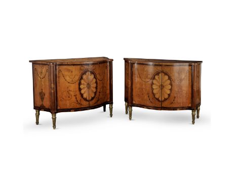 A fine pair of George III satinwood, burr elm, and purple heart marquetry commodesThe serpentine tops inlaid with scrolled ac