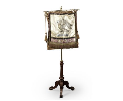 A Victorian walnut and brass pole screenTogether with a turned giltwood and gesso standard lamp, with three lion paw feet, th