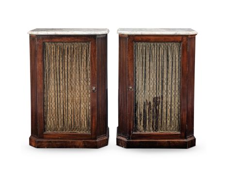 A pair of mahogany cabinetsFirst half 19th century and adaptedWith marble tops, above pleated material and wire mounted panel