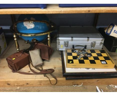 Shelf of assorted including a Globe