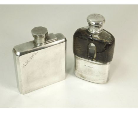 HIP FLASK ETC. A Victorian silver mounted glass hip flask (leather worn), London 1871. Also, an Art Deco silver plated hip fl