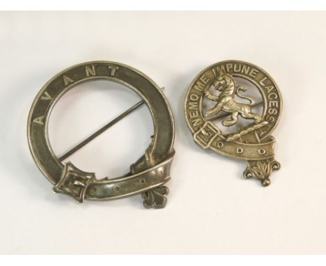 CLAN PINS. A cloak pin by M. Rettie & Son, of Aberdeen, of strap & buckle design, diameter 5.2cm. Also, one other Scottish cl