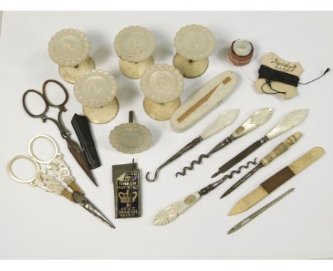 SEWING ITEMS. Including mother of pearl spools, a pair of mother of pearl mounted needlework scissors, other tools, needles e