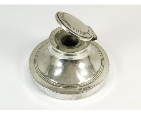 SILVER INKWELL. A silver capstan inkwell, Chester 1915. Diameter of base 11.5cm. CHARITY LOT: This lot is being auctioned on 