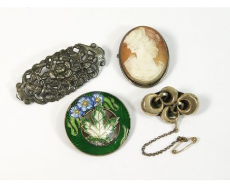 CAMEO ETC. An 800 standard silver brooch set a carved cameo shell. Also, a sterling silver gilt & enamel maple leaf brooch & 