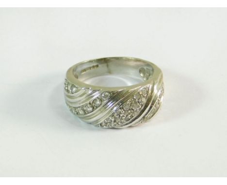 GOLD RING. A modern 9ct. gold ring, pave-set with diamonds. Size K/L. Approx. 4.7g.  Note that all items in this auction are 