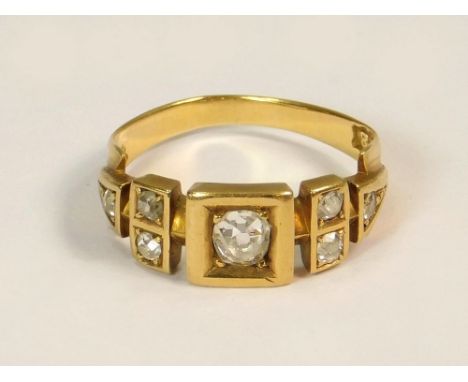 DIAMOND RING. A 19th century 18ct. gold eight stone diamond ring, the central diamond of approx. 0.25ct. spread. Size K.  Not