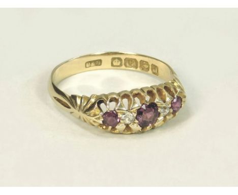 GOLD RING. An early 20th century, 18ct. gold ruby & diamond five stone ring. Size L.  Note that all items in this auction are