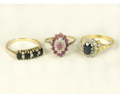 GOLD RINGS. Two 9ct. gold dress rings: a modern ruby cluster ring & a 9kt. four stone sapphire & diamond ring. Also, a sapphi