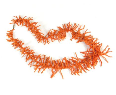 CORAL. A long stick coral necklace with barrel clasp.  Note that all items in this auction are previously owned & are offered