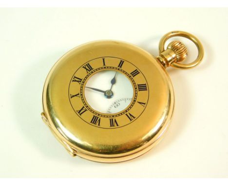 GOLD POCKET WATCH. A 9ct. gold half hunter pocket watch, Birmingham 1927, the movement dust cover engraved with a presentatio