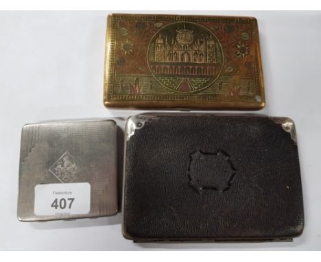 A LEATHER PURSE WITH SILVER CORNERS A STAINLESS STEEL COMPACT BY DUBARRY TOGETHER WITH AN INDIAN BRASS CIGARETTE CASE DEPICTI