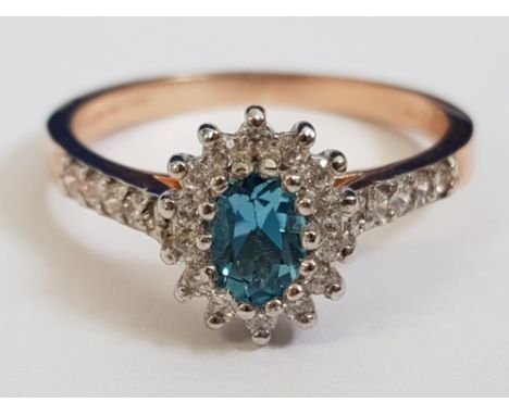 9CT ROSE GOLD CUBIC ZIRCONIA AND BLUE STONE RING, 2.5G SIZE P