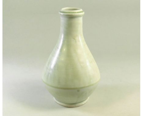 MIKE DODD. A matt celadon glaze bottle vase. Impressed mark. Height 19cm.