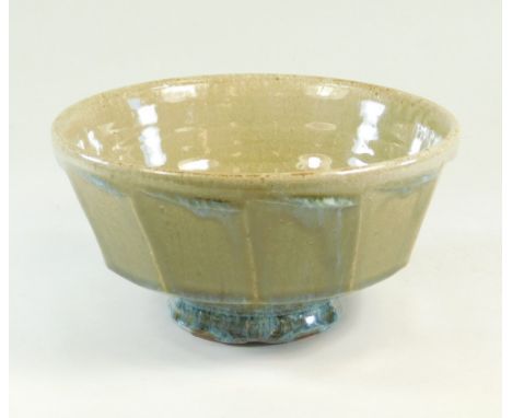 MIKE DODD. A cut-sided, footed bowl. Chips around foot where glaze has adhered in kiln. Mark obscured by glaze. Diameter 20cm