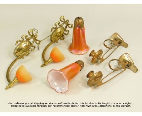 LIGHTING. A pair of brass piano sconces, a pair of brass wall lights &amp; two cased glass shades.