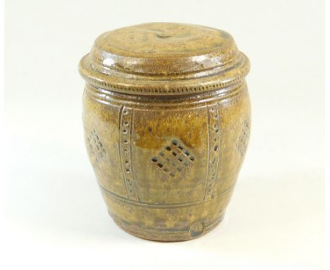 MIKE DODD. A lidded jar with incised &amp; impressed decoration. Impressed mark. Height 14cm.