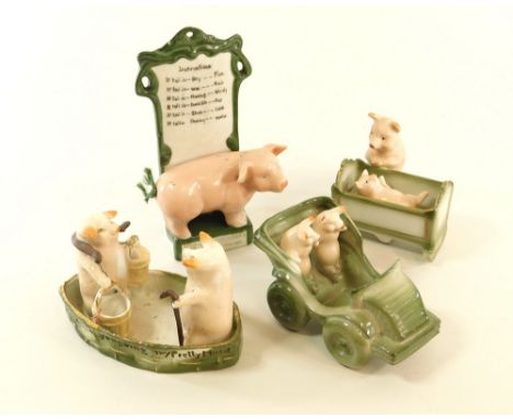 FAIRINGS. Four various German pig fairings, including a Pig-barometer. Height 18cm.