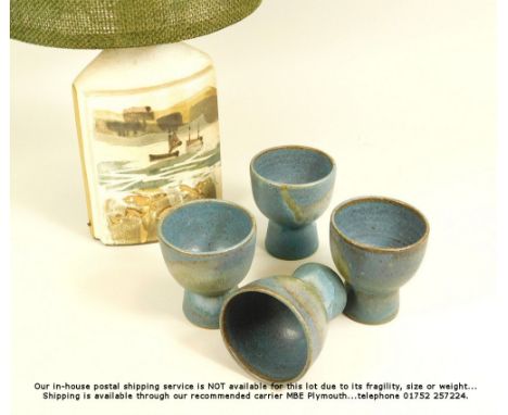 CORNISH POTTERY. A Tremaen Pottery 'Fishing Boats' lamp base, with original hessian shade. Full height 44cm. Also, a set of f