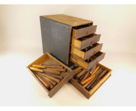 WOOD CARVER'S TOOLS.A cabinet of drawers containing 89 wood worker's chisels, many named including: Herring Bros (17); Harris