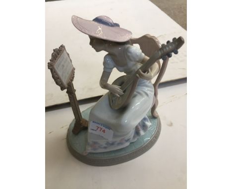 LLADRO FIGURE OF A GIRL PLAYING A LYRE - REPAIREDMUSIC STAND DAMAGED AS PICTURED, PUTTY RESIDUE VISIBLE AT BASE OF GUITAR.