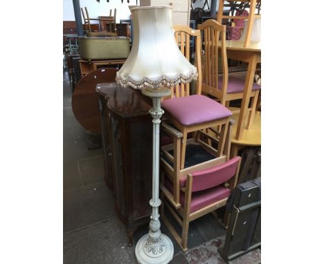 A CARVED STANDARD LAMP