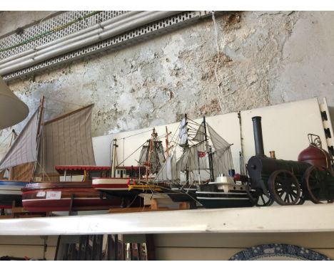 SEVEN WOODEN MODEL BOATS AND A STEAM ENGINE