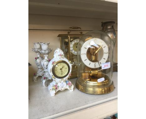TWO GLASS CASED CLOCKS AND PORCELAIN SMALL CLOCK SET
