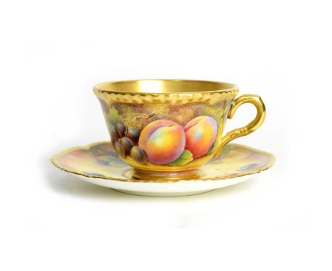 A modern fruit painted Royal Worcester teacup and saucer by D.Fuller, decorated with peaches, cherries, grapes, blackberries 