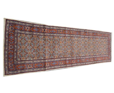 A Moud runner, with repeated flowerhead design, 248 x 77cms.