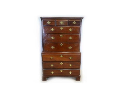 A George III mahogany chest-on-chest, the upper section with dentil cornice above three short and three long graduated drawer