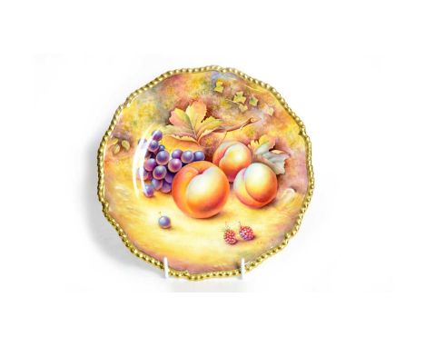 A modern Royal Worcester fruit-painted plate by P. English, decorated with peaches, grapes and raspberries, within a gadroon 