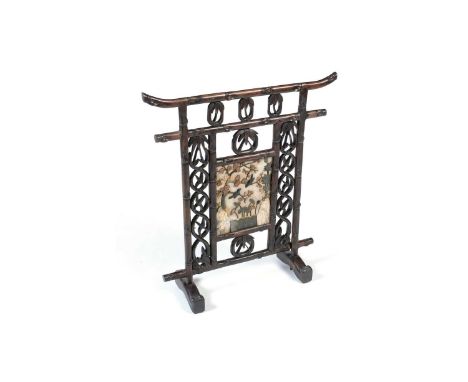 A Chinese carved hardwood firescreen, c1900, the frame modelled as bamboo, with central inlaid hardstone panel depicting bird