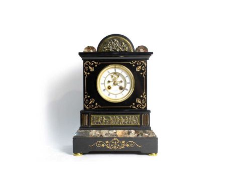 Henry Marc, Paris: a 19th Century black slate and marble mantel clock, the enamelled roman dial with visible brocot escapemen