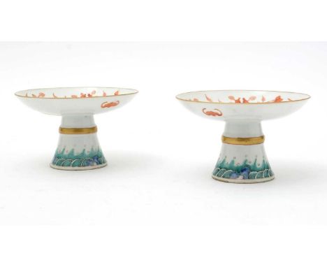 A pair of Chinese footed dishes, 19th Century, decorated in iron-red with finger citrons, bats and characters, the bases deco