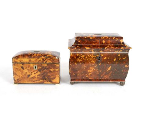 A George III tortoiseshell tea caddy, of sarcophagus form with ivory edges and handles to covers, raided on bronzed metal fee