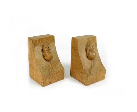 Workshop of Robert ‘Mouseman’ Thompson (Kilburn): a pair of adzed oak bookends, carved with mouse trademark, 9.5 x 9 x 15cms.