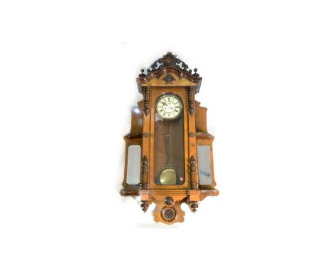 Gustav Becker: a large and impressive Vienna walnut wall clock, the enamelled roman dial with subsidiary seconds dial, with b