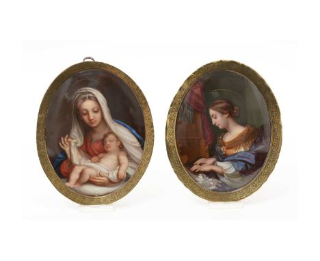 A pair of late 19th Century Meissen oval porcelain plaques, painted with a portrait of St Cecilia, the patron saint of musici