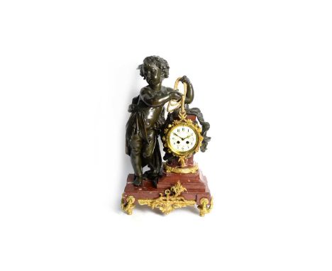 An ornate late 19th Century French bronzed spelter, marble and gilt metal mantel clock, the enamelled arabic dial with two tr